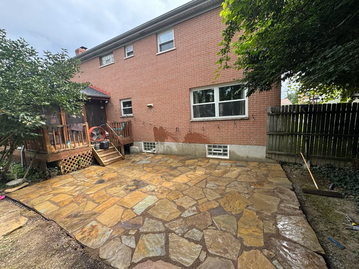 Flagstone courtyard completed by Queen City Hardscapes