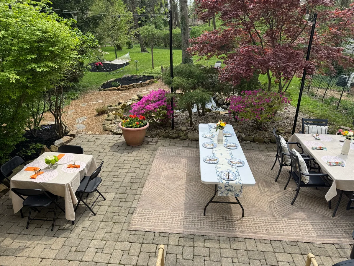 Pond beside a paver patio in Anderson Township, OH completed by Queen City Hardscapes
